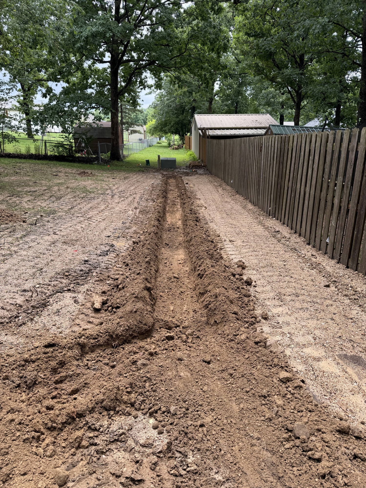 After — seeded and strawed area, swale complete