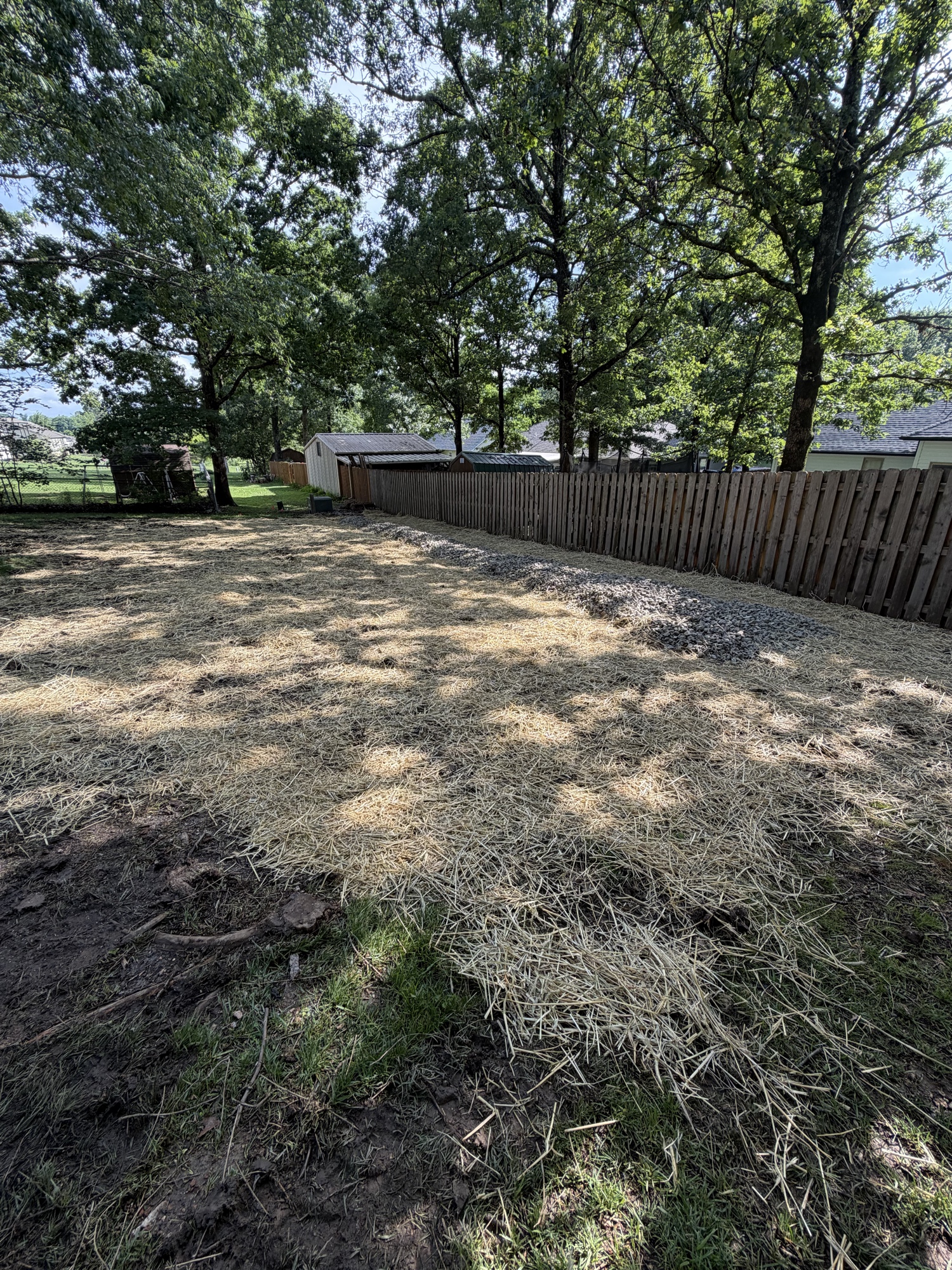 After — limestone swale along fence line complete